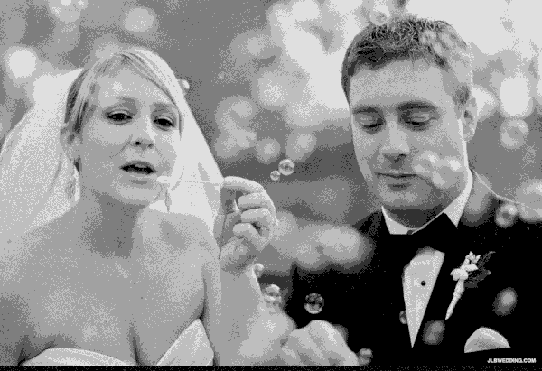 blowing bubbles wedding photo