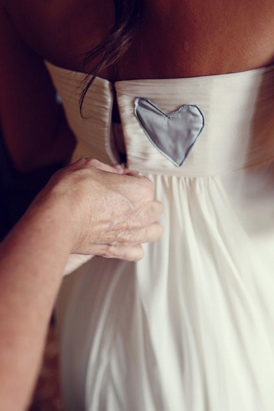 something old handkerchief sewn into wedding dress